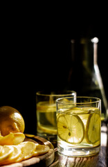 Fresh lemon juice. Moody background.