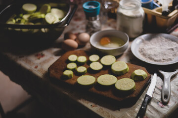 Obraz na płótnie Canvas sliced zucchini on a vintage chopping board in the kitchen 