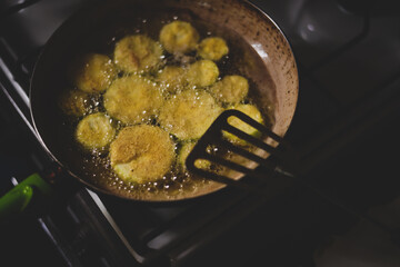 sliced zucchini cooked in oil in a pan. fried pumpkin recipe