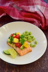 Grilled salmon with mango avocado tomato salsa and edamame beans