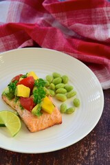 Grilled salmon with mango avocado tomato salsa and edamame beans
