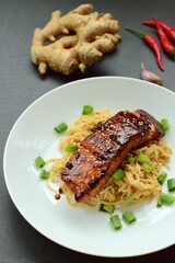 Somen noodle with teriyaki salmon, sprinkle with sliced scallions and sesame seeds