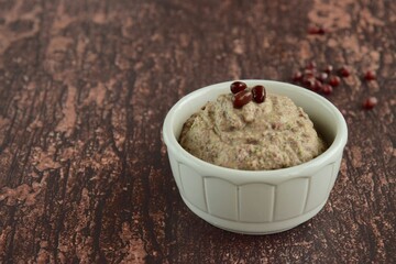 Adzuki or red mung bean hummus on wooden background