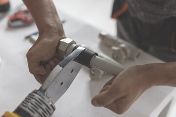 Man keep soldering iron for polypropylene