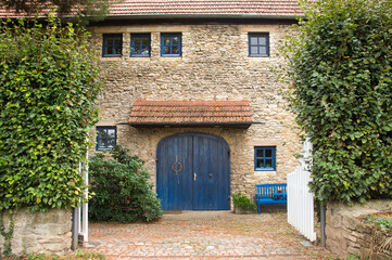 Fototapeta na wymiar Historic house with blue door in Florsheim Dalsheim, Germany.