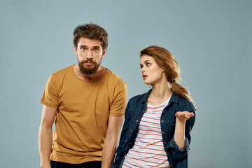 Fototapeta premium fashion couple emotions fun studio communication blue background