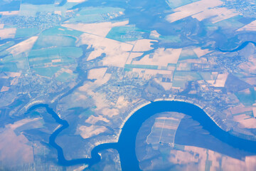 Aerial photo of river and land . View from the airplane 
