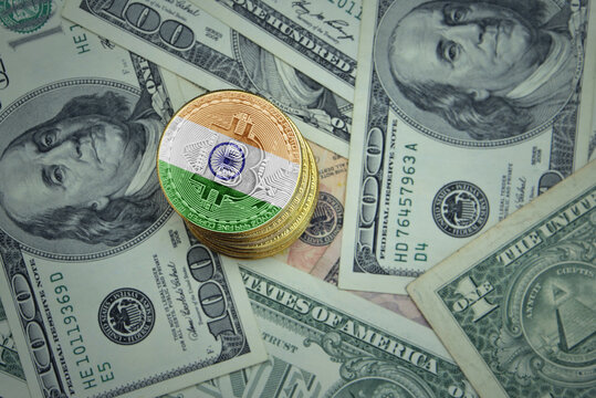 golden shining bitcoins with flag of india on a dollar money background.