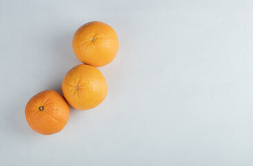 Fresh orange fruit isolated on a white background