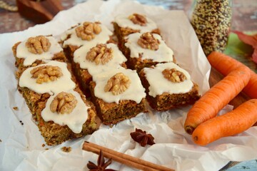 Gluten free carrot quinoa square cake bites topped with sugar glaze and walnut