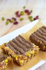Chocolate avocado tart with pistachio date almond cranberry crust