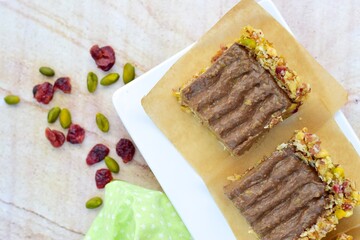 Chocolate avocado tart with pistachio date almond cranberry crust