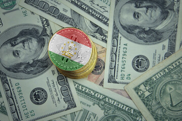 golden shining bitcoins with flag of tajikistan on a dollar money background.