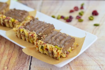 Chocolate avocado tart with pistachio date almond cranberry crust