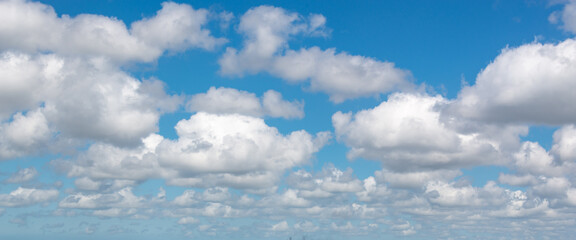Naklejka na ściany i meble Panoramic background of blue sky with clouds