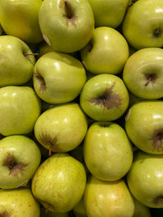 Green apples in the market.
