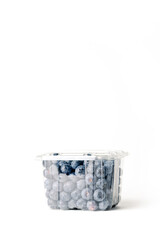 transparent blueberry jar, on white background, with closed lid, front view, vertical format