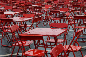 Red table and chairs after heavy rain