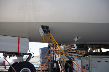 Refueling the plane at the airport. Close-up, place for text