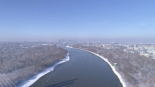 The Vistula River in Warsaw during a Cold temperature winter day. Partly covered with ice. Siekierkowski Bridge.