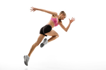 Fototapeta na wymiar In jump. Caucasian professional female athlete, runner training isolated on white studio background. Muscular, sportive woman. Concept of action, motion, youth, healthy lifestyle. Copyspace for ad.
