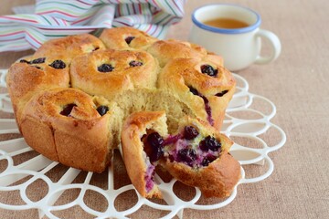 Homemade blueberry cinnamon rolls served with tea