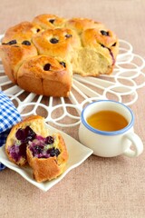 Homemade blueberry cinnamon rolls served with tea
