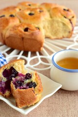 Homemade blueberry cinnamon rolls served with tea
