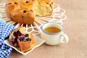 Homemade blueberry cinnamon rolls served with tea