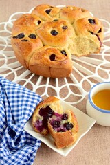Homemade blueberry cinnamon rolls served with tea