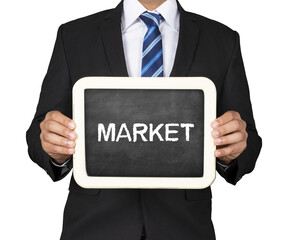 A business man is holding slate mini black board with market message.