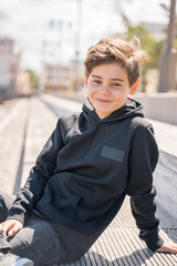 Portrait of teenager outdoors on blurred background