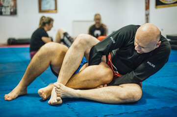 BJJ Brazilian jiu-jitsu ground fight training combat sparing. Leg lock calf slicer submission control technique