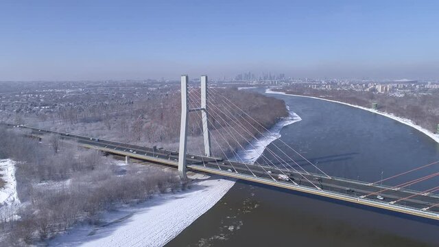 Panorama of the city of Warsaw with the Siekierkowski Bridge in the foreground. A winter day.
