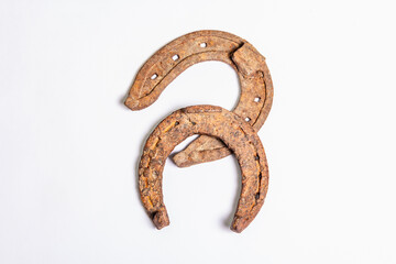 Cast iron metal horseshoes isolated on white background