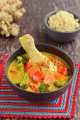 Homemade chicken curry with carrot, broccoli and red bell pepper. Served with brown rice