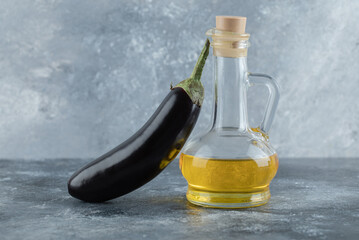 Organic fresh eggplant with bottle of oil