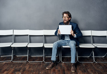 A man holds in his hands a job interview standby. Professional manager