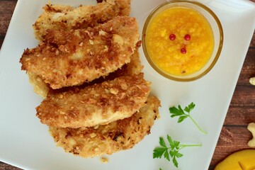 Chicken fingers breaded with cashew and coconut flakes. Served with mango red pepper dip