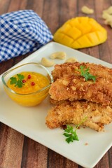 Chicken fingers breaded with cashew and coconut flakes. Served with mango red pepper dip