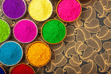 Holi color powder. Organic Gulal colors in bowl for Holi festival, Hindu tradition festival. Bright vibrant Holi