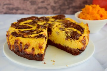Homemade pumpkin chocolate swirl cheesecake