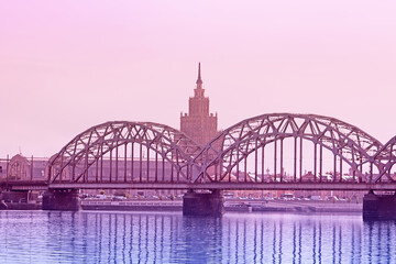 View of Latvian Academy of Sciences, Railway bridge and Daugava river on the sunrise in Riga, Latvia