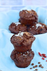 Chocolate muffins with coconut flakes, goji berry and chocolate chips