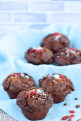 Chocolate muffins with coconut flakes, goji berry and chocolate chips