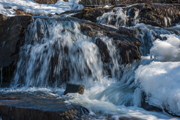 A small waterfall on the river in the spring