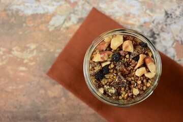 Homemade granola with buckwheat, brazil nut, almond, bee pollen, raisin, chia seed and sesame seeds