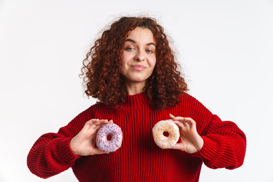 Joyful Ginger Curly Girl Making Fun With Doughnuts