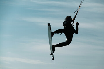 Kiteboard or kitesurfing tricks. Summer sport learning how to kitesurf. Kite surfing on Puck bay in...