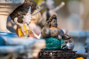 Vintage figurine of traditional Thai ceremonial dancer in temple Thailand